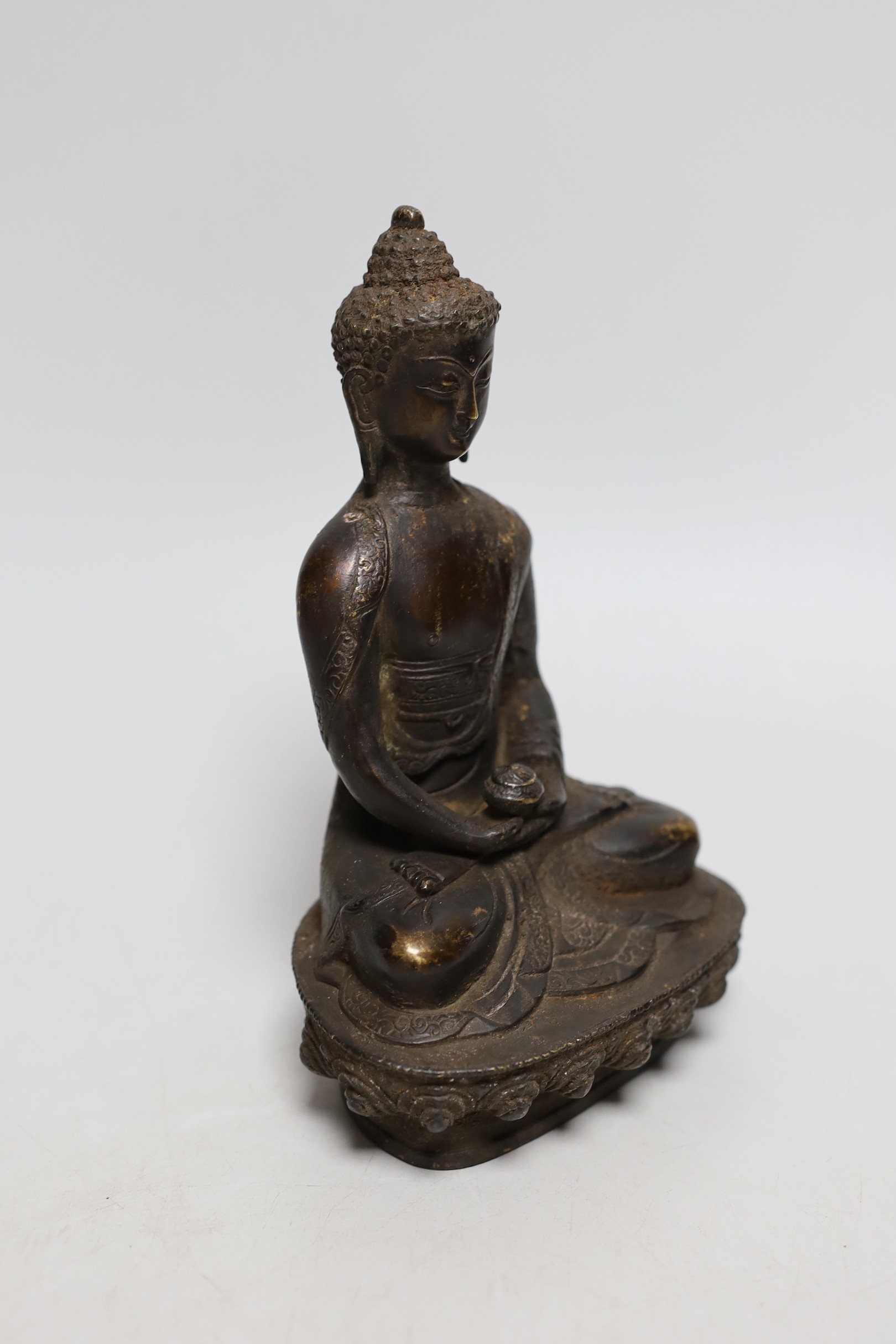 A Himalayan bronze figure of Buddha, 19.5cms high